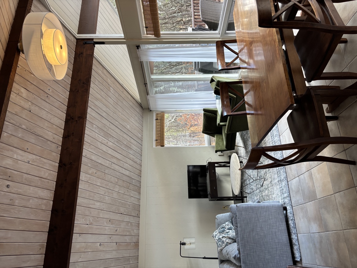 Open living and dining area with vaulted ceiling